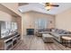 Living area featuring a sectional sofa and large TV at 4109 E Barwick Dr, Cave Creek, AZ 85331