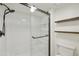 Bathroom with walk-in shower, floating shelves, and white subway tile at 4149 W Park Ave, Chandler, AZ 85226