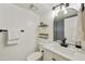 Modern bathroom with gray tile shower and floating shelves at 4149 W Park Ave, Chandler, AZ 85226