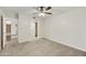 Bedroom with ceiling fan, carpet, and adjacent bathroom at 4149 W Park Ave, Chandler, AZ 85226