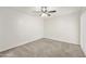 Bright bedroom with ceiling fan and grey carpeting at 4149 W Park Ave, Chandler, AZ 85226