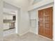 Bright entryway with wood door and view into a modern kitchen at 4149 W Park Ave, Chandler, AZ 85226