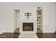 Fireplace with built-in shelving on either side at 4149 W Park Ave, Chandler, AZ 85226