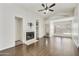 Living area featuring hardwood floors, a fireplace, and built-in shelving at 4149 W Park Ave, Chandler, AZ 85226