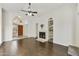 Open living room with hardwood floors, vaulted ceiling and fireplace at 4149 W Park Ave, Chandler, AZ 85226