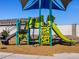 Modern playground equipment under a shaded play structure at 4296 W Jeanette Ln, San Tan Valley, AZ 85144