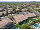 Aerial view of house, pool, and surrounding homes at 4410 E Robin Ln, Phoenix, AZ 85050