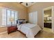 Guest bedroom with a queen bed and an ensuite bathroom at 4410 E Robin Ln, Phoenix, AZ 85050