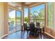 Bright breakfast nook with a table and chairs overlooking the backyard at 4410 E Robin Ln, Phoenix, AZ 85050