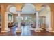 High ceilings and elegant columns grace this open living and dining area at 4410 E Robin Ln, Phoenix, AZ 85050