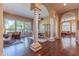 High ceilings and elegant columns grace this open living and dining area at 4410 E Robin Ln, Phoenix, AZ 85050