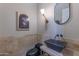 Modern powder room with a contemporary sink and dark tile at 4410 E Robin Ln, Phoenix, AZ 85050