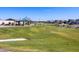 Landscaped green space with walking path and playground in the background at 4420 W Josephine St, San Tan Valley, AZ 85144