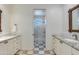 Shared bathroom with double sinks and checkered floor at 4643 E Montecito Ave, Phoenix, AZ 85018