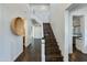 Elegant staircase with dark hardwood floors and white railings at 4643 E Montecito Ave, Phoenix, AZ 85018