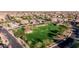 Aerial view of a lush neighborhood park with walking paths and green space at 4813 S Quantum Way, Mesa, AZ 85212