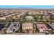 Expansive aerial view of a suburban home showcasing its well-kept landscaping and desert mountain backdrop at 4813 S Quantum Way, Mesa, AZ 85212