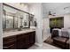 Primary bath with granite counters and views into main bedroom at 4813 S Quantum Way, Mesa, AZ 85212