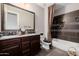 Bathroom with double sinks, tile floors, and a shower/bath combination at 4813 S Quantum Way, Mesa, AZ 85212