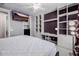 Bedroom featuring a workspace with built-in shelves and desk and mounted tv at 4813 S Quantum Way, Mesa, AZ 85212