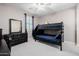 Bedroom boasts bunk beds with blue sheets and a dresser for ample storage at 4813 S Quantum Way, Mesa, AZ 85212