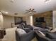 Spacious bonus room with comfortable seating and a large TV at 4813 S Quantum Way, Mesa, AZ 85212