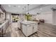 Kitchen island with granite countertops and sink, view to living room and outdoor living space at 4813 S Quantum Way, Mesa, AZ 85212