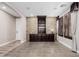 Neutral living room showcasing a stone accent wall, custom built-ins, and lots of natural light at 4813 S Quantum Way, Mesa, AZ 85212