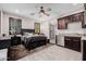 Spacious main bedroom showcasing ceiling fan and convenient wet bar at 4813 S Quantum Way, Mesa, AZ 85212