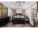 Bright and airy main bedroom features a ceiling fan, a comfortable bed, and ample natural light at 4813 S Quantum Way, Mesa, AZ 85212