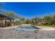 Backyard with luxurious pool, built-in grill, and plenty of space for lounging at 4813 S Quantum Way, Mesa, AZ 85212