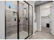 Tiled walk-in shower with glass enclosure and upgraded fixtures at 4813 S Quantum Way, Mesa, AZ 85212