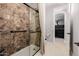 Shower stall with shower seat and brown tile at 4813 S Quantum Way, Mesa, AZ 85212