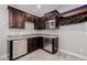 Wet bar area equipped with stainless steel appliances and granite countertops at 4813 S Quantum Way, Mesa, AZ 85212