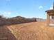 Spacious backyard with block wall fencing, ready for landscaping at 4847 W Hunter Trl, San Tan Valley, AZ 85144