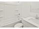 This bathroom features an all-white tub and shower combination with sink and faucet at 4847 W Hunter Trl, San Tan Valley, AZ 85144