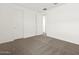 An empty carpeted bedroom with white walls and an open doorway at 4847 W Hunter Trl, San Tan Valley, AZ 85144