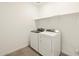 Convenient laundry room with modern washer and dryer units and storage shelf at 4847 W Hunter Trl, San Tan Valley, AZ 85144