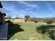 Landscaped backyard offering a large grassy area at 4905 W Magellan Dr, New River, AZ 85087