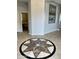 Elegant foyer with circular patterned tile and high ceilings at 4905 W Magellan Dr, New River, AZ 85087