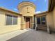 Inviting entryway with a wooden door and stone bench at 4905 W Magellan Dr, New River, AZ 85087