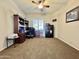 Home office with built-in wooden desk and ample storage at 4905 W Magellan Dr, New River, AZ 85087