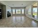 Relaxing living room featuring a fireplace and access to the backyard at 4905 W Magellan Dr, New River, AZ 85087