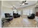 Relaxing living room featuring comfortable seating and tile flooring at 4905 W Magellan Dr, New River, AZ 85087