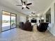 Living room with sliding doors leading to the backyard patio at 4905 W Magellan Dr, New River, AZ 85087