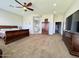 Main bedroom with large windows, a ceiling fan, and plenty of space at 4905 W Magellan Dr, New River, AZ 85087