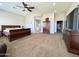 Main bedroom with large windows, a ceiling fan, and plenty of space at 4905 W Magellan Dr, New River, AZ 85087