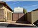 Side yard with RV gate and large motorhome at 4905 W Magellan Dr, New River, AZ 85087