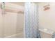 Clean bathroom with shower/tub combo and decorative shower curtain at 510 N Alma School Rd # 158, Mesa, AZ 85201