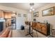 Bright dining area with kitchen view, stylish table and chairs, and modern cabinetry at 5122 E Shea Blvd # 2054, Scottsdale, AZ 85254